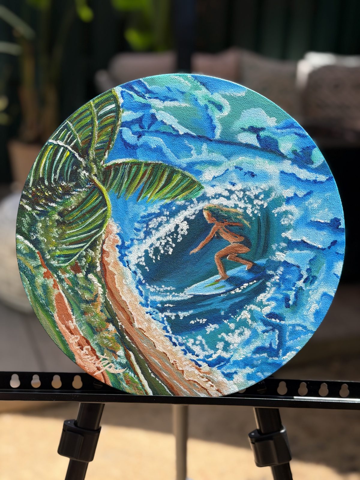 French Surfer Girl in Venice — round canvas painting of a surfer riding a wave beneath a palm tree
